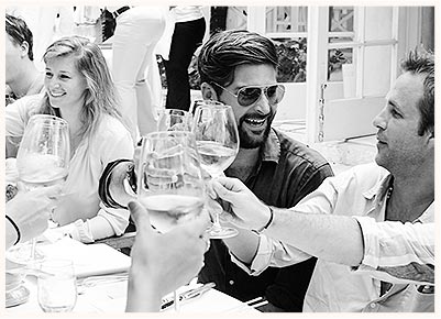 Table of Friends Cheers at Luncheon